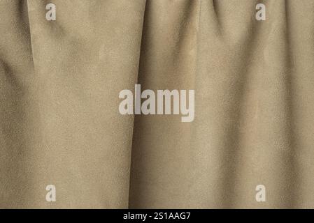 Beige suede wrinkled background. Suede leather texture Stock Photo