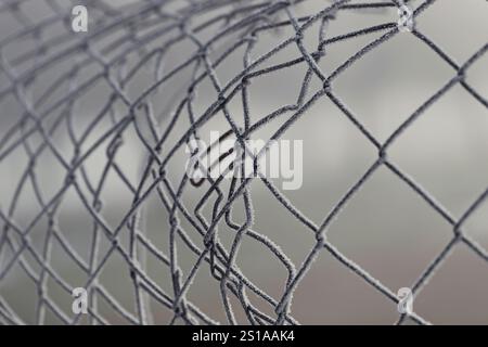 Metal link fence with wire Stock Photo