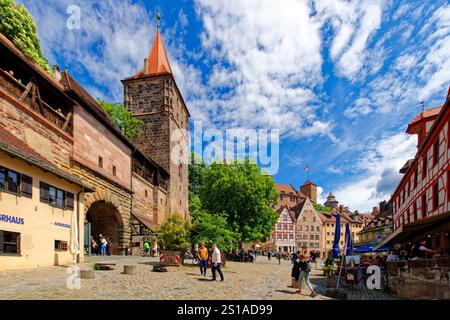 Germany, Bavaria, Franconia, Nuremberg, Old town, Platz am Tiergärtnertor square, City gate Tiergärtnertor, half timbered houses and Kaiserburg, Imper Stock Photo