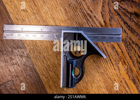 A small combination square with both inches and millimeters Stock Photo