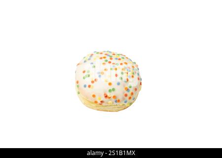 A white donut with rainbow sprinkles on top. Splashes of different colors are scattered throughout the donut. Donut on a white background. Stock Photo