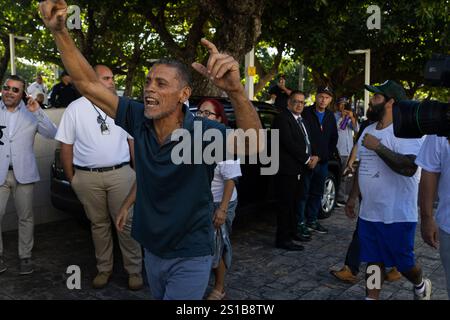 San Juan, USA. 02nd Jan, 2025. Environmental activists walk through the outside of the Puerto Rican Capitol Building during the government's swearing-in ceremony in San Juan, Puerto Rico on Jan. 2, 2025. (Carlos Berríos Polanco/Sipa USA) Credit: Sipa USA/Alamy Live News Stock Photo