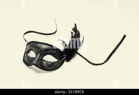 Carnival Venetian mask with black feathers decoration isolated on white Stock Photo