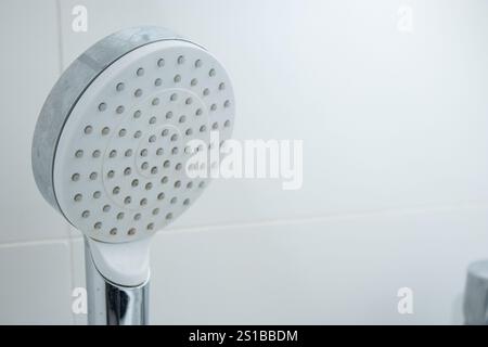 Close up of a modern shower head with limescale stains Stock Photo