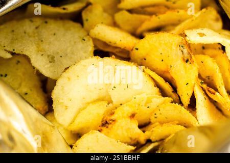 Bag with potato chips. Close up of crispy chips. Crunchy snack in package. Unhealthy fast food Stock Photo