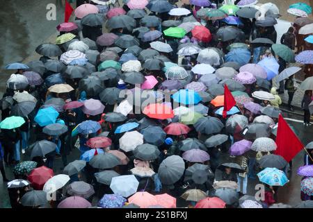 Demonstration of people with umbrellas on the street, Bilbao, Basque Country, Spain Stock Photo