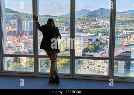 Business man talking on phone, looking at city, San Mames Stadium, Euskalduna Palace, Views from the Iberdrola Tower, Bilbao, Basque Country, Spain Stock Photo