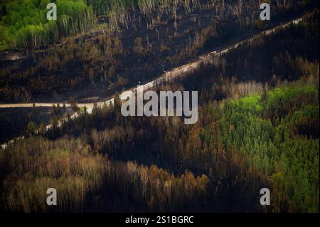 Timmins, Canada. 27th May, 2012. A new study suggests Canadian forests are increasingly primed for severe wildfires, underlining the pressing need to proactively mitigate the increased threat posed by climate change. An aerial view slow-burning forest fire is shown west of Timmins, Ont., on Sunday, May 27, 2012. Credit: The Canadian Press/Ģ����ý Live News Stock Photo