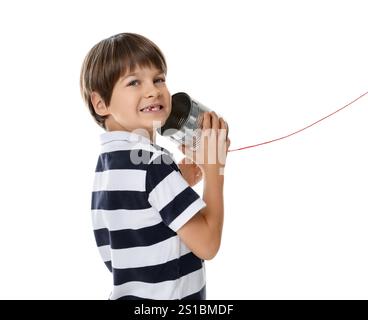 Boy using tin can telephone on white background Stock Photo