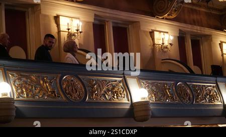 Austro - Hungarian theater interior with decorative lightening.An elegant theater interior with ornate decorations, chandeliers, and blue lighting. Stock Photo