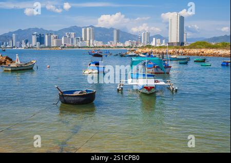 Panoramic daytime view of Nha Trang city, Vietnam. Fishing boats at sea. Stock Photo