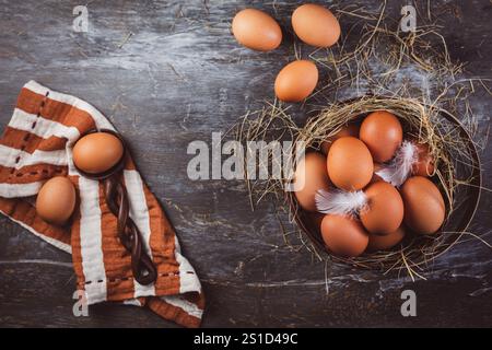 Organic brown eggs in a basket on kitchen table Stock Photo
