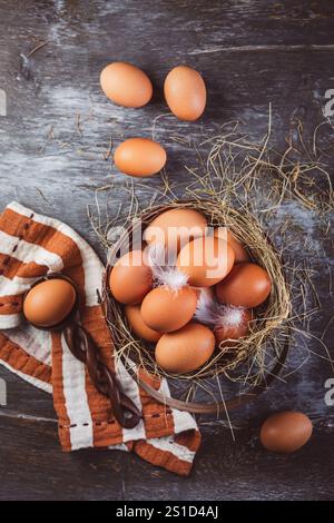 Organic brown eggs in a basket on kitchen table Stock Photo