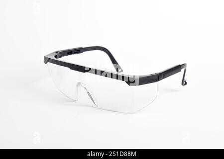 Clear plastic safety goggles isolated on white background Stock Photo