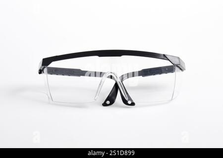 Clear plastic safety goggles isolated on white background Stock Photo