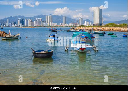 Panoramic daytime view of Nha Trang city, Vietnam. Fishing boats at sea. Stock Photo