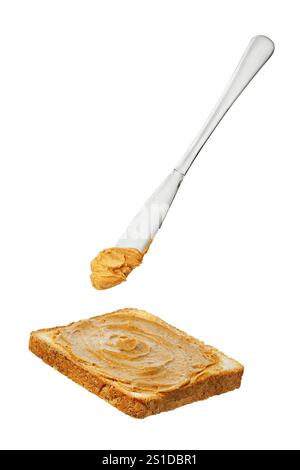 peanut butter falling from knife on toasts in saucer isolated on white ...