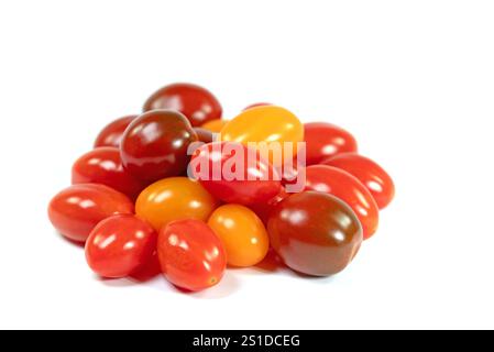 Various mini tomatoes against a white background Stock Photo