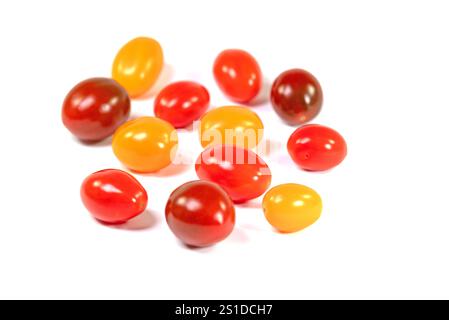 Various mini tomatoes against a white background Stock Photo