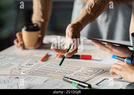 Creative UX UI Design Brainstorming Session with Designers Collaborating on Wireframes and Prototypes Stock Photo