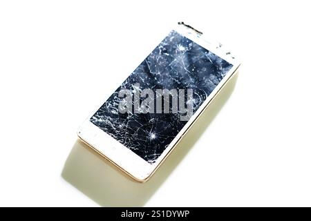 Black broken touch screen phone with cracked screen. Smashed glass Stock Photo