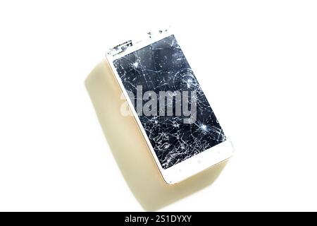 Black broken touch screen phone with cracked screen. Smashed glass Stock Photo