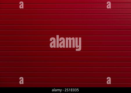 Texture of red metal door surface. Red striped background Stock Photo