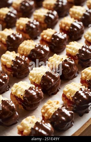 Homemade Christmas cookies filled with marmalade and dipped in chocolate Stock Photo