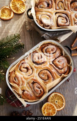 Homemade cinnamon rolls in two enameled baking pans, top view Stock Photo