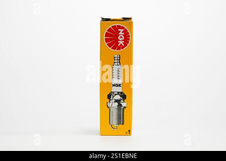 Close up a pack of NGK Spark Plug isolated on white background Stock Photo