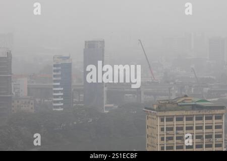 General view of buildings and residential area in Dhaka city covered with fog during a winter day. Stock Photo