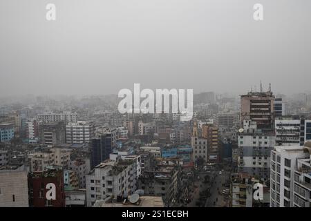 General view of buildings and residential area in Dhaka city covered with fog during a winter day. Stock Photo