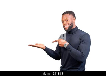 Cheerful entrepreneur pointing at his open hand showing an imaginary product while smiling at camera Stock Photo