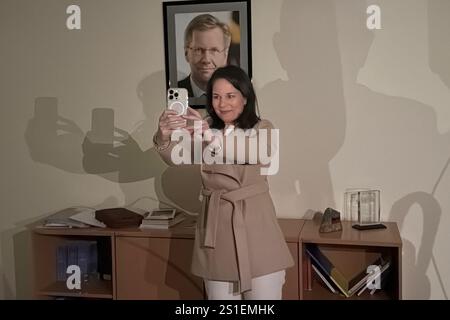 Damaskus, Syria. 03rd Jan, 2025. Foreign Minister Annalena Baerbock (Alliance 90/The Greens) takes a selfie in front of a portrait of former German President Christian Wulff during a visit to the German embassy in Damascus, which was closed in 2012 for security reasons. Foreign Minister Baerbock is on a surprise visit to Syria around four weeks after the fall of long-term ruler al-Assad. Credit: Jörg Blank/dpa/Ģ����ý Live News Stock Photo