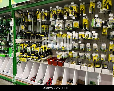 Kyiv, Ukraine - January 03, 2025: Various gardening tools, accessories, and gear neatly arranged on shelves in a hardware store, offering customers a Stock Photo