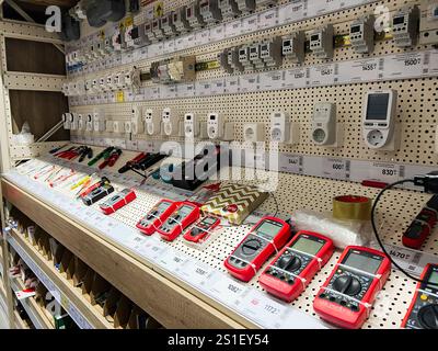 Kyiv, Ukraine - January 03, 2025: An organized shelf showcasing a variety of electronic tools and measurement devices commonly used in electrical and Stock Photo