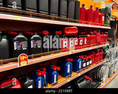 Kyiv, Ukraine - January 03, 2025: Display of colorful gasoline containers arranged on store shelves, showcasing their variety and deals. Perfect for i Stock Photo