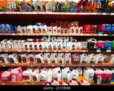 Kyiv, Ukraine - January 03, 2025: Variety of automotive products such as coolants, antifreeze, and oil displayed on store shelves. Stock Photo