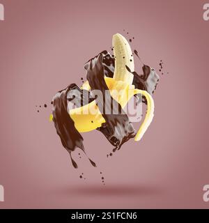 banana in chocolate splash on a pink background. Stock Photo