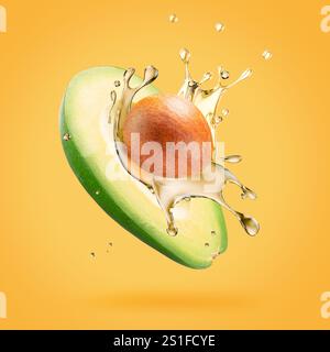 avocado with oil splash on a light green background. Stock Photo