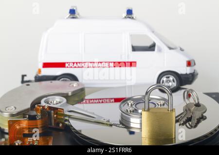 Opened hard drive with small padlock in detail Stock Photo
