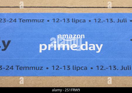 WETZLAR, Germany - 2022-07-16: Amazon Prime logotype printed on cardboard box security scotch tape. Amazon Prime is a service from Amazon which delive Stock Photo