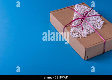 Present box, decoration of gift on table, top view with copy space. Stock Photo