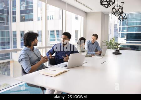 Diverse male project managers meeting in co-working space Stock Photo