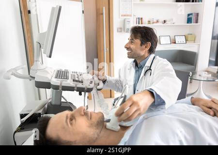 Positive ultrasound diagnosis doctor using scanner for examining male patients Stock Photo