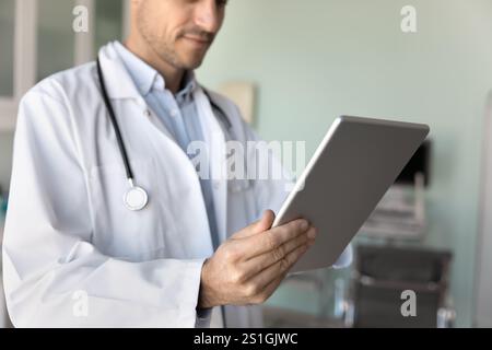 Male physician doctor in white coat using modern technology Stock Photo