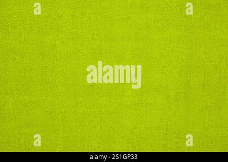 Old shabby yellow green painted wall, grunge background, texture. Stock Photo
