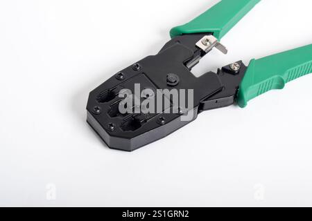 Crimping Tools isolated on white background. Crimping pliers. functions to cut cables and install RJ45 connectors with cables Stock Photo