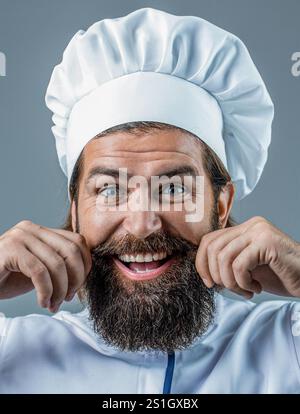 Man chef. Professional happy man chef ready to cook new dish. Male chef, cook or baker in white hat and apron Stock Photo