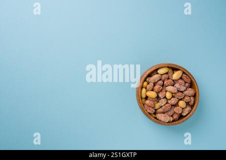 Top view of salted peanuts in wooden bowl Stock Photo